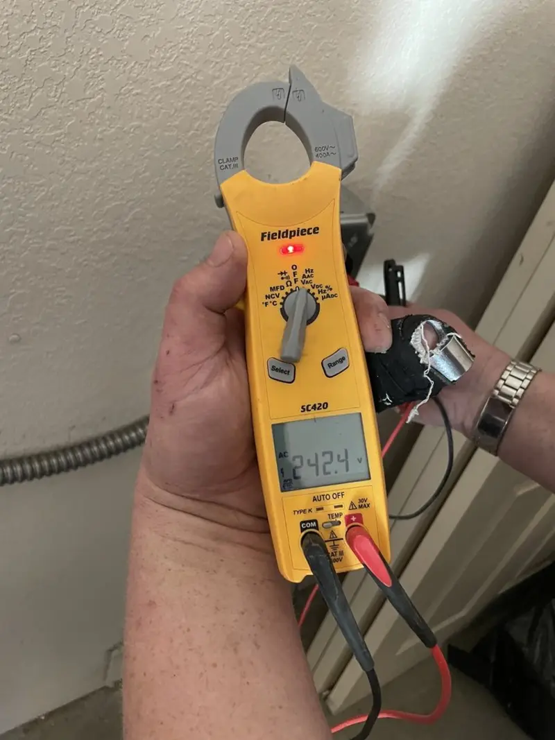 Voltage testing with clamp meter during Recessed Lighting Installation in Duncanville